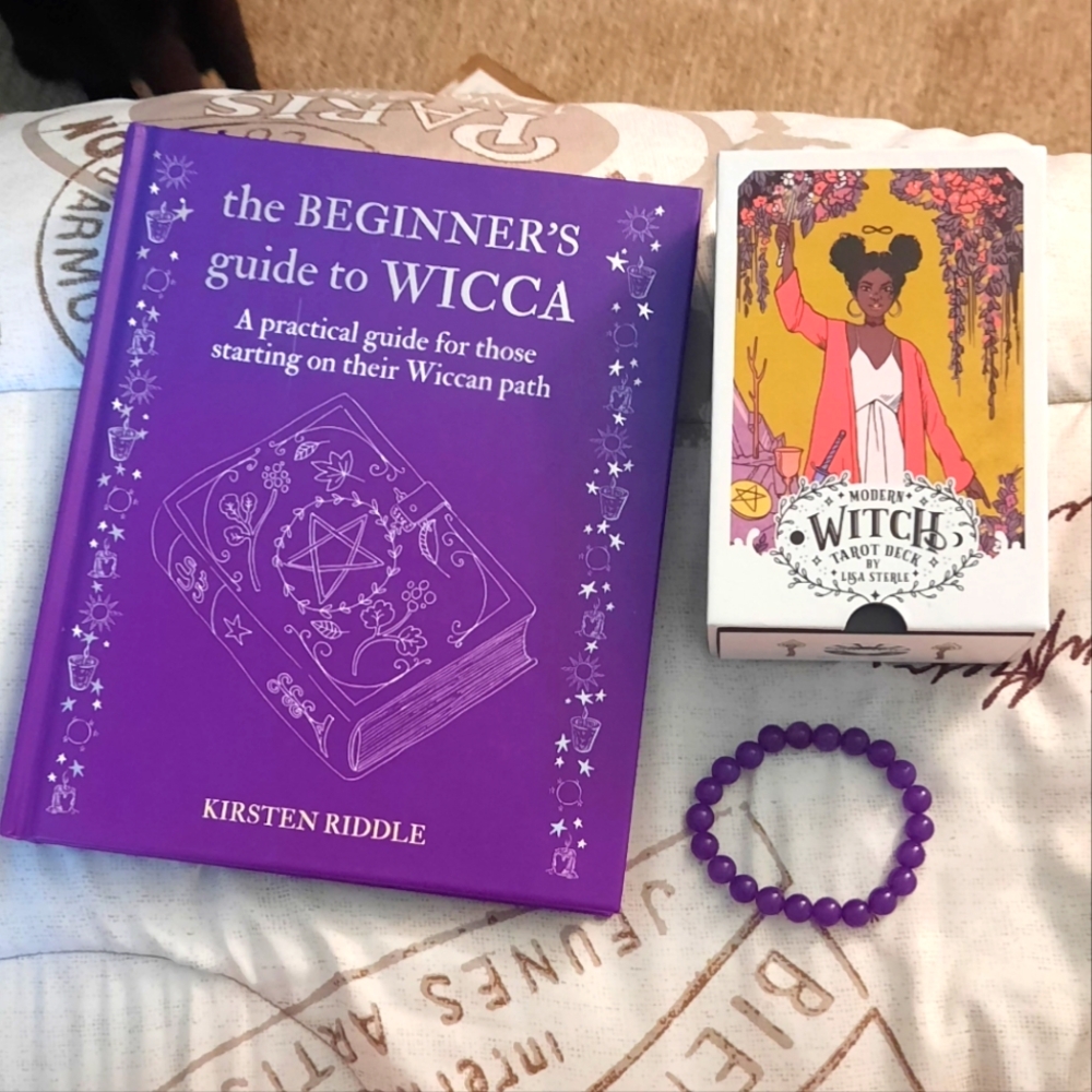 Modern Witch Tarot Deck, the beginners guide to wicca, and an amethyst bracelet